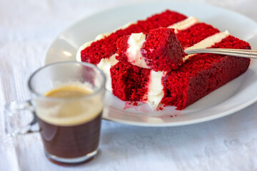 Traditional and delicious red velvet cake isolated on white plate