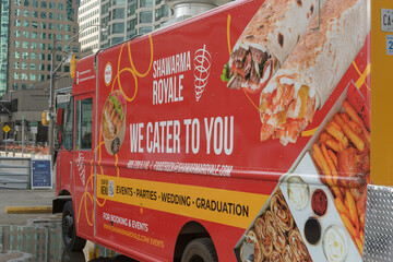 Naklejka premium exterior of Shawarma Royale, a middle eastern cuisine food truck parked on Queens Quay near the waterfront in downtown Toronto, Canada