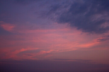 a purple and pink sky with a purple and purple sunset