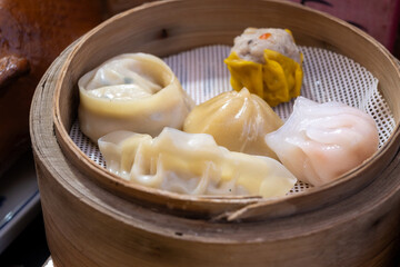 Asian food, steamed cooked filled gyoza dumplings in street cafe ready to eat
