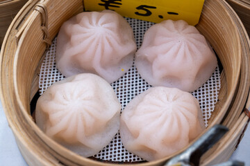 Asian food, steamed cooked filled gyoza dumplings in street cafe ready to eat