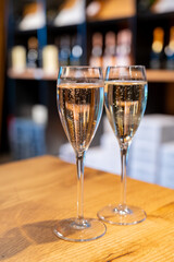 Tasting sparkling white wine, traditional champagne method making of cremant in caves on Moselle river valley in Luxembourg, wine tour and visiting caves