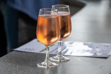 Tasting of white , rose, young dry wine made on Moselle river valley in Germany or Luxembourg, view on terraced vineyards