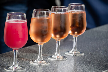 Tasting of white , rose, young dry wine made on Moselle river valley in Germany or Luxembourg, view on terraced vineyards