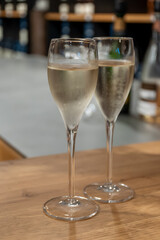 Tasting sparkling white wine, traditional champagne method making of cremant in caves on Moselle river valley in Luxembourg, wine tour and visiting caves