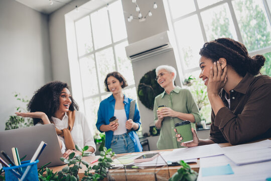 Photo of corporate four colleagues women feminists tea break funny blab share ideas meeting coworking successful nice light office