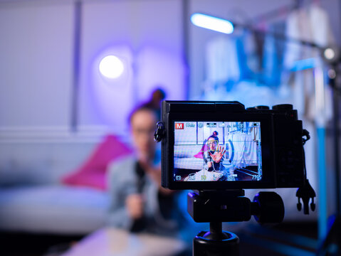 Live streaming session modern home video content indoor environment close-up view digital interaction