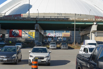 Fototapeta premium view of Rogers Centre and elevated Gardiner Expressway/Lake Shore Boulevard West from Rees St. Parking lot in downtown Toronto, Canada