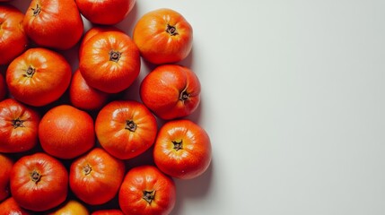 Juicy, orange persimmons piled together, set against a plain white background.