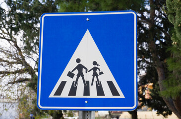 Blue Pedestrian Crossing Sign on Street