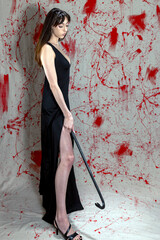 Side Profile of Woman Holding Crowbar Against Blood-Spattered Backdrop in Horror Portrait
