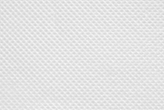 A sheet of clean tiled white tissue paper as background