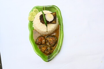 Delicious Indian fish curry with rice. Traditional Asian fish curry dish. Asian food and meal. It is liked all over India. Indian style fish curry served in plate with rice. Indian food. 