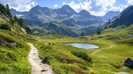 Naklejka premium A peaceful mountain landscape with a winding trail leading to a serene lake, ideal for hiking enthusiasts and nature lovers