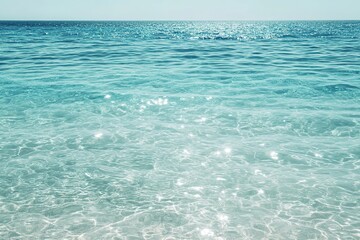 Obraz premium Tranquil turquoise ocean glistening under sunlight