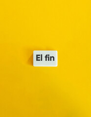 The End Word. Text on Block Letter Tile on Yellow Background. Minimal Aesthetic.