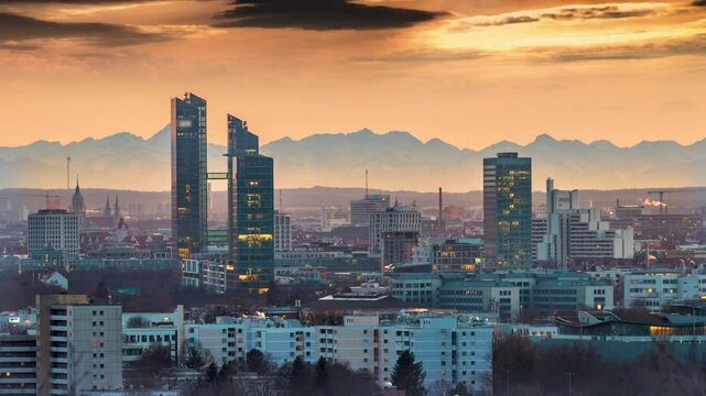 Panorama Munich city skyline aerial view skyscrapers time lapse at sunset, munich germany downtown cityscape night view.