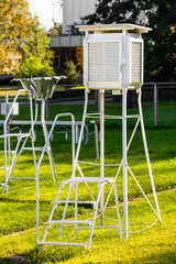 meteorological booth on a stand with an extension ladder. meteorological street equipment....