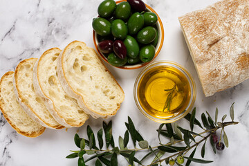appetizer, sliced ciabatta bread, with olive oil, green olives, Chalkidiki olives, classic Green...