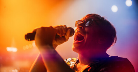 Young Indie Band Playing a Rock Music Gig with Alternative Punk Tracks at a Festival with Energetic...