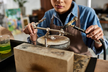 Dedicated artisan skillfully crafting a stunning jewel in a bright, lively workspace.