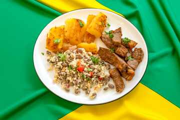 Traditional rustic tropical Brazilian dish, sun-dried beef with green beans, cassava, biquinho...