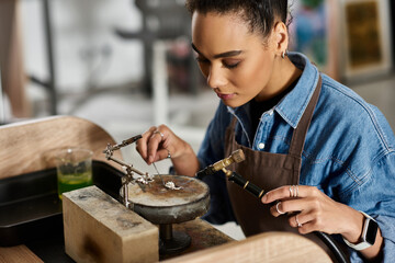 The talented artisan meticulously designs exquisite jewelry with precision and care.