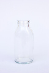 A glass transparent jar or container on white background. You can fill it with liquids or other things.