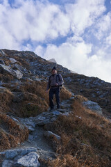 Man hiking in a cold day in the rocky mountains