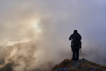 Man hiking in a cold day in the rocky mountains