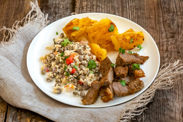 Traditional rustic tropical Brazilian dish, sun-dried beef with green beans, cassava, biquinho pepper. Creative rustic photography