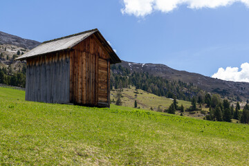 the beautiful alpine meadow called Prato piazza or Plätzwiese in the autonomous province Bolzano in italy with tiny little agricultural huts