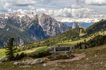a beautiful wooden bench at the hiking path of the plätzwiese Prato Piazza, italy