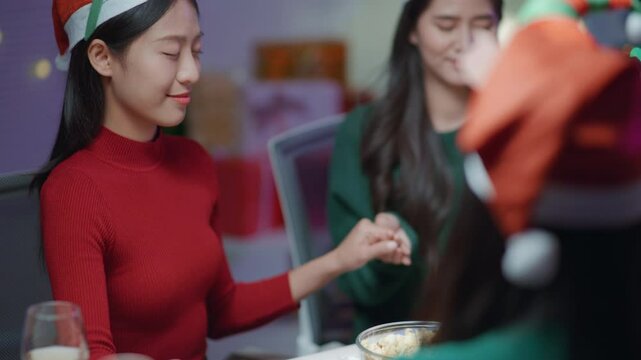 People holding hands of each others for prayers for before meals in thanksgiving.