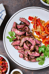 Skirt steak with veggies, corn tortillas, guacamole and pico de gallo