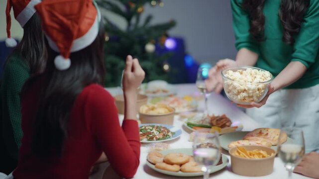 Friends join and celebrate the party with get cheers give a toast by clink glasses eating foods and drinks champagne. Happy and joyful in holiday weekend and festival.