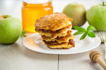 fried pancakes with apples and honey