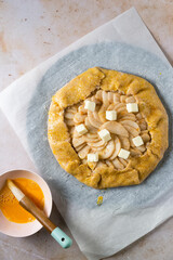 Overhead view pear galette being made