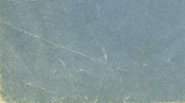 Old blue book cover background. Texture of vintage cardboard. 