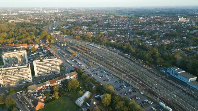 dendermonde railway station trains tracks essential for passenger transport includes sint gillis bij background backward aerial drone shot view footage 