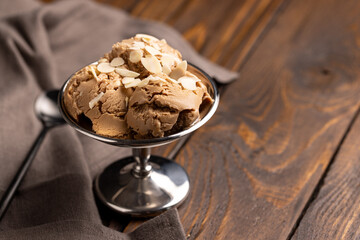 Balls of nut ice cream in a metal creamer