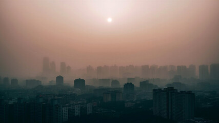 Sepia sunlight filters through the haze of an urban skyline softening tall modern buildings and faint greenery in a serene and cinematic dawn scene.