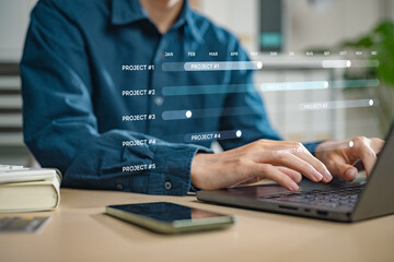 intelligence, managing, project, marketing, plan, planning, program, strategy, timeline, working. A man is typing on a laptop. The laptop screen shows a timeline of projects and products.