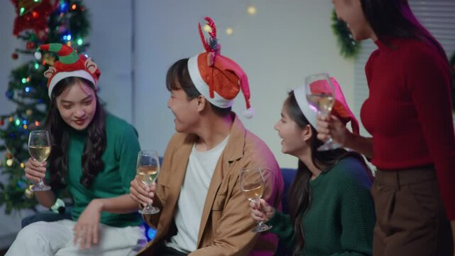Friends join and celebrate the party with get cheers give a toast by clink glasses eating foods and drinks champagne. Happy and joyful in holiday weekend and festival.
