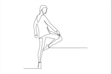 Obraz premium A minimalist line drawing of a person striking a pose with one leg raised.
