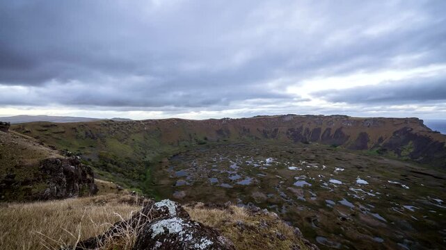 Sunrise illuminates the rano kau volcano crater on easter island, showcasing the breathtaking beauty of chile's landscape