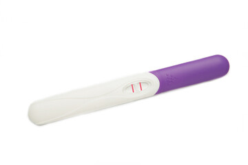 The pregnancy test with two stripes isolated on white background. Health care concept. Top view