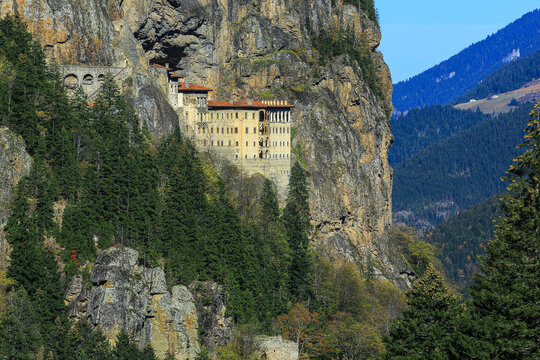 Image of the monastery built into the rocks on the mountainside.