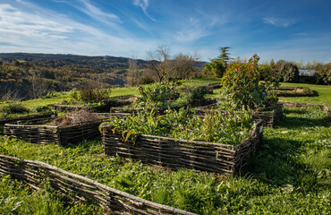 The dtraditional garden beds of the Chateau de Pagax with ancient plants