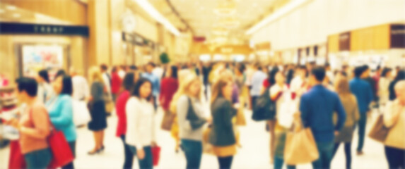 Obraz premium Blurred background of a holiday shopping rush is in full effect as shoppers fill their carts, black friday, shopping